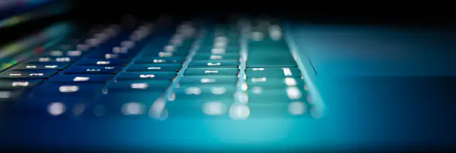 A laptop keyboard. Tetrel's reports are expertly crafted with prescriptive guidance to minimize friction during remediation.